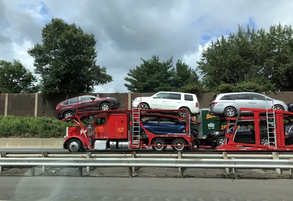 Auto transport carrier truck hauling vehicles across the country
